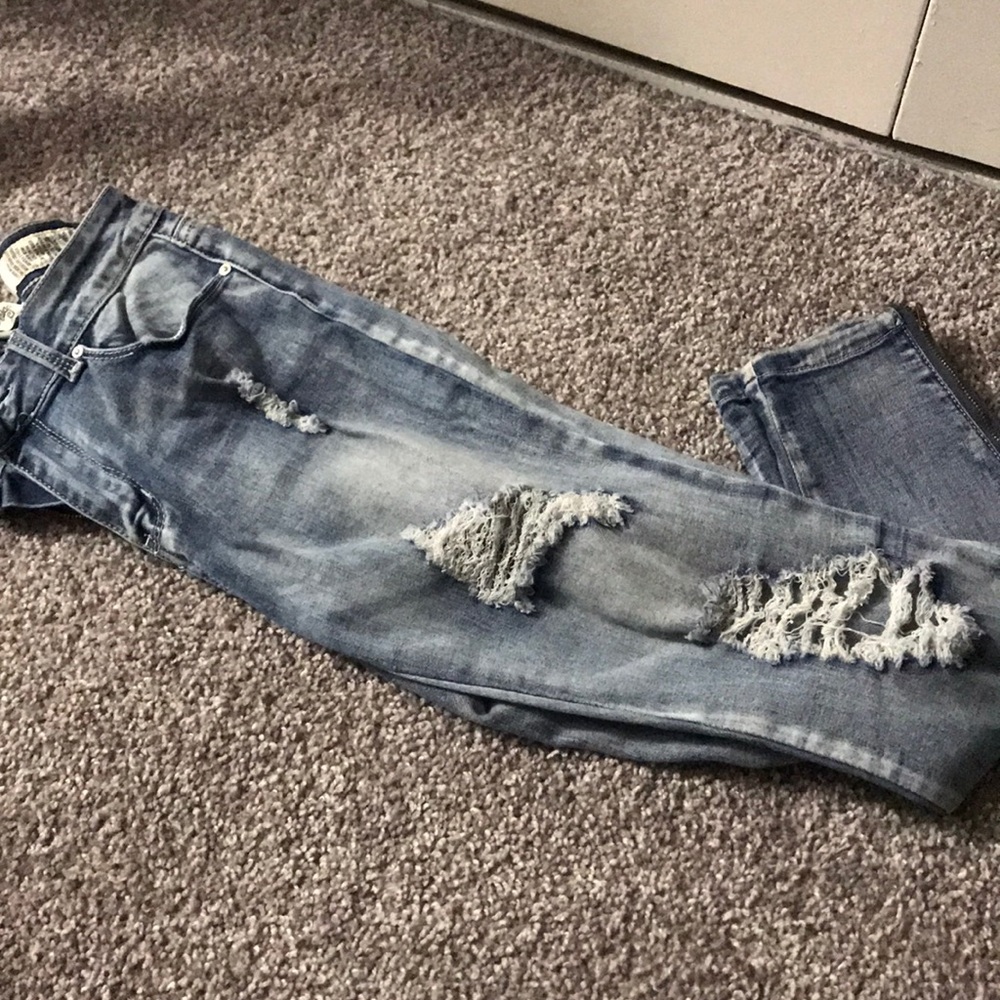 Jeans distressed with zipped tight ankle up